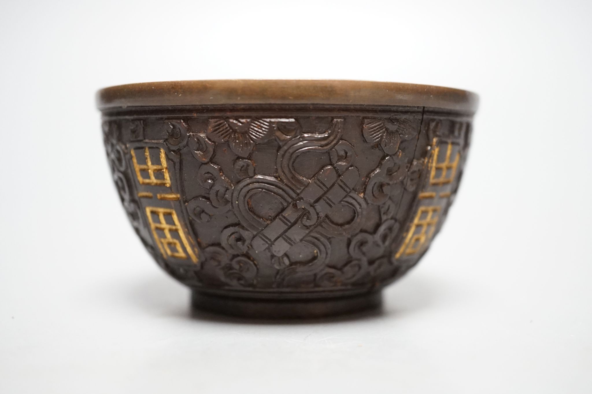 A Chinese coconut cup, 18th/19th century., 8.5 cms diameter.